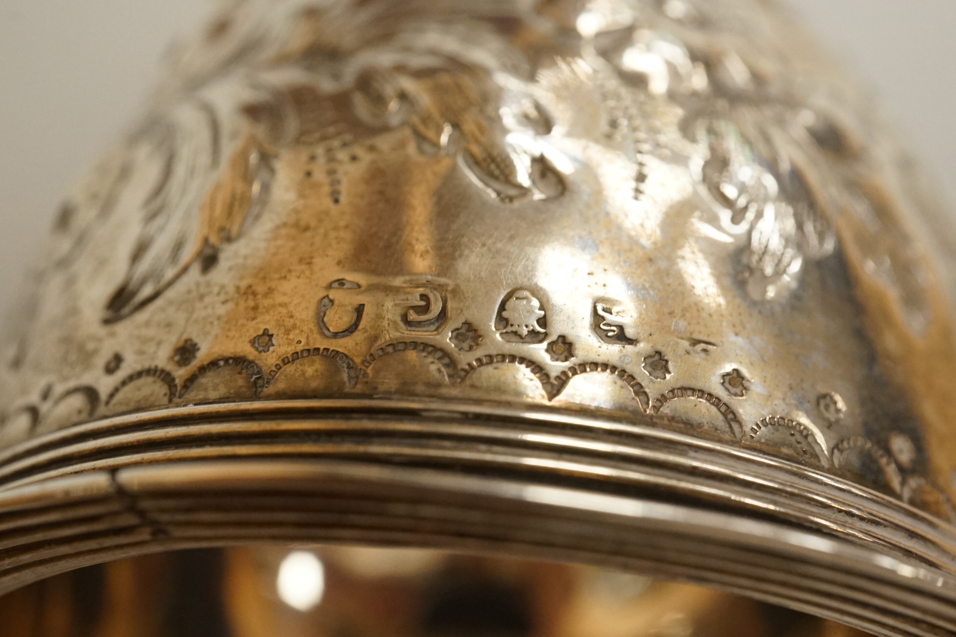 A George III silver wine funnel, with later embossed decoration and later engraved inscription, Crispin Fuller, London 1802, 13.4cm (a.f.).